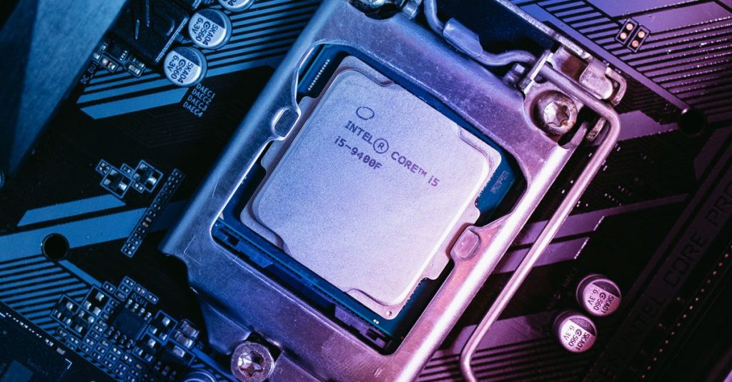 Detailed view of a computer motherboard with installed CPU, showcasing high-tech components.